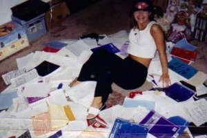 Me, a Junior in high school, sitting among some of my books.  