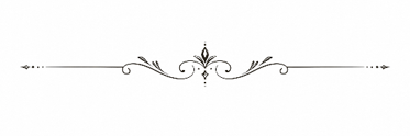Ornamental decorative divider with floral elements in black and white.